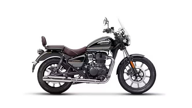 Royal Enfield Meteor 350 in black and chrome with a brown seat and a small windscreen, side view